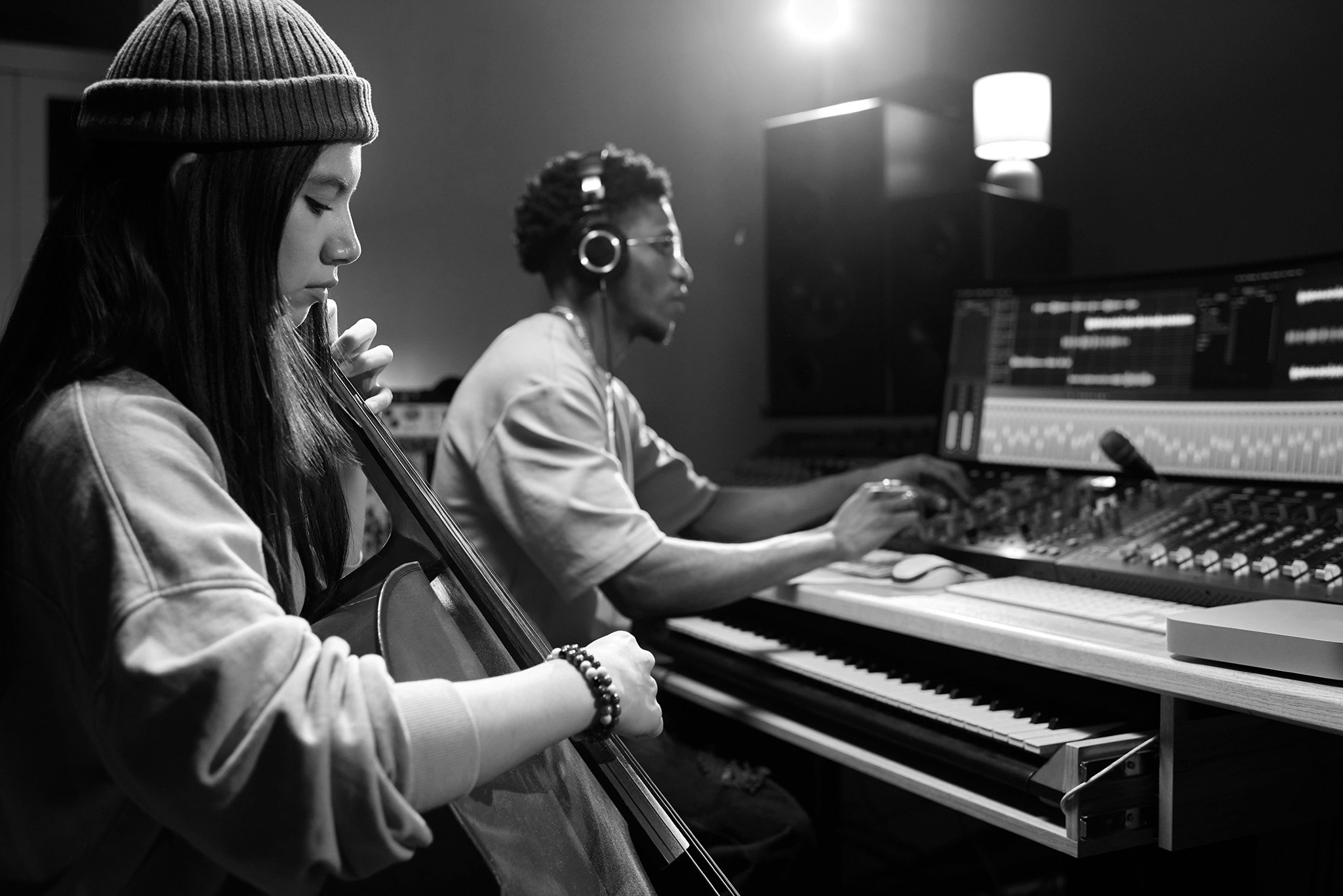 Two musicians working in music studio