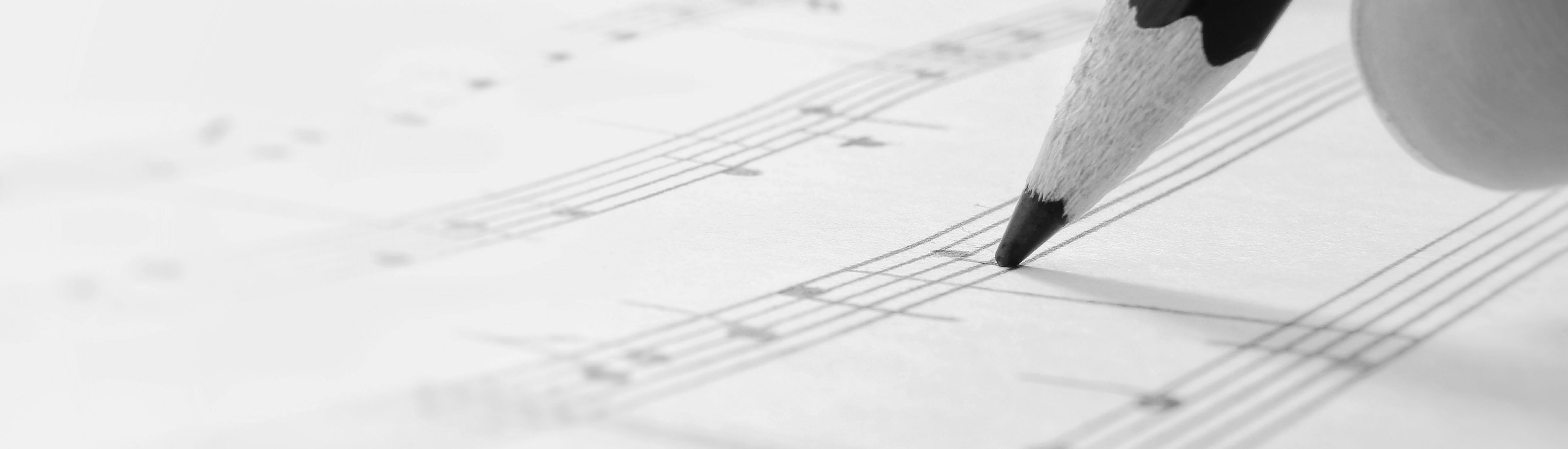 zoom in of pencil being used to write music